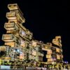 Stunning view of the illuminated Atlantis The Royal Hotel in Dubai, showcasing its modern architecture against the night sky.