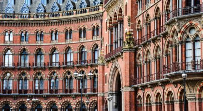 Detailed exterior view of the iconic St Pancras Renaissance Hotel in London, showcasing its Victorian architecture.
