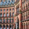 Detailed exterior view of the iconic St Pancras Renaissance Hotel in London, showcasing its Victorian architecture.