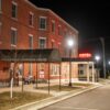 Night view of the Historic Anderson House Hotel in Wabasha, MN, with streetlights illuminating the scene.