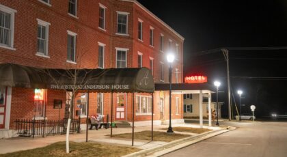Night view of the Historic Anderson House Hotel in Wabasha, MN, with streetlights illuminating the scene.