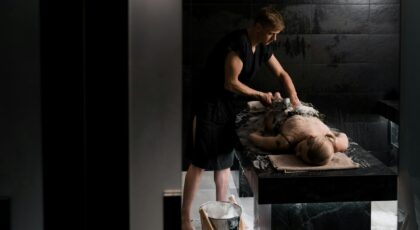 A professional giving a soothing soap massage in a relaxing spa environment, promoting relaxation and wellness.