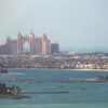 A stunning aerial view of Atlantis The Palm resort in Dubai, with the city skyline.