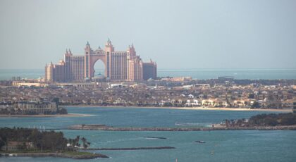 A stunning aerial view of Atlantis The Palm resort in Dubai, with the city skyline.