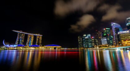 Experience the illuminated Singapore skyline with Marina Bay Sands at night.