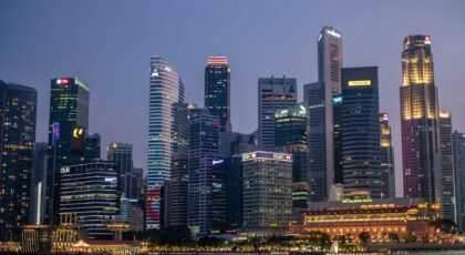 Stunning night view of Singapore's illuminated skyline showcasing iconic skyscrapers and waterfront reflections.